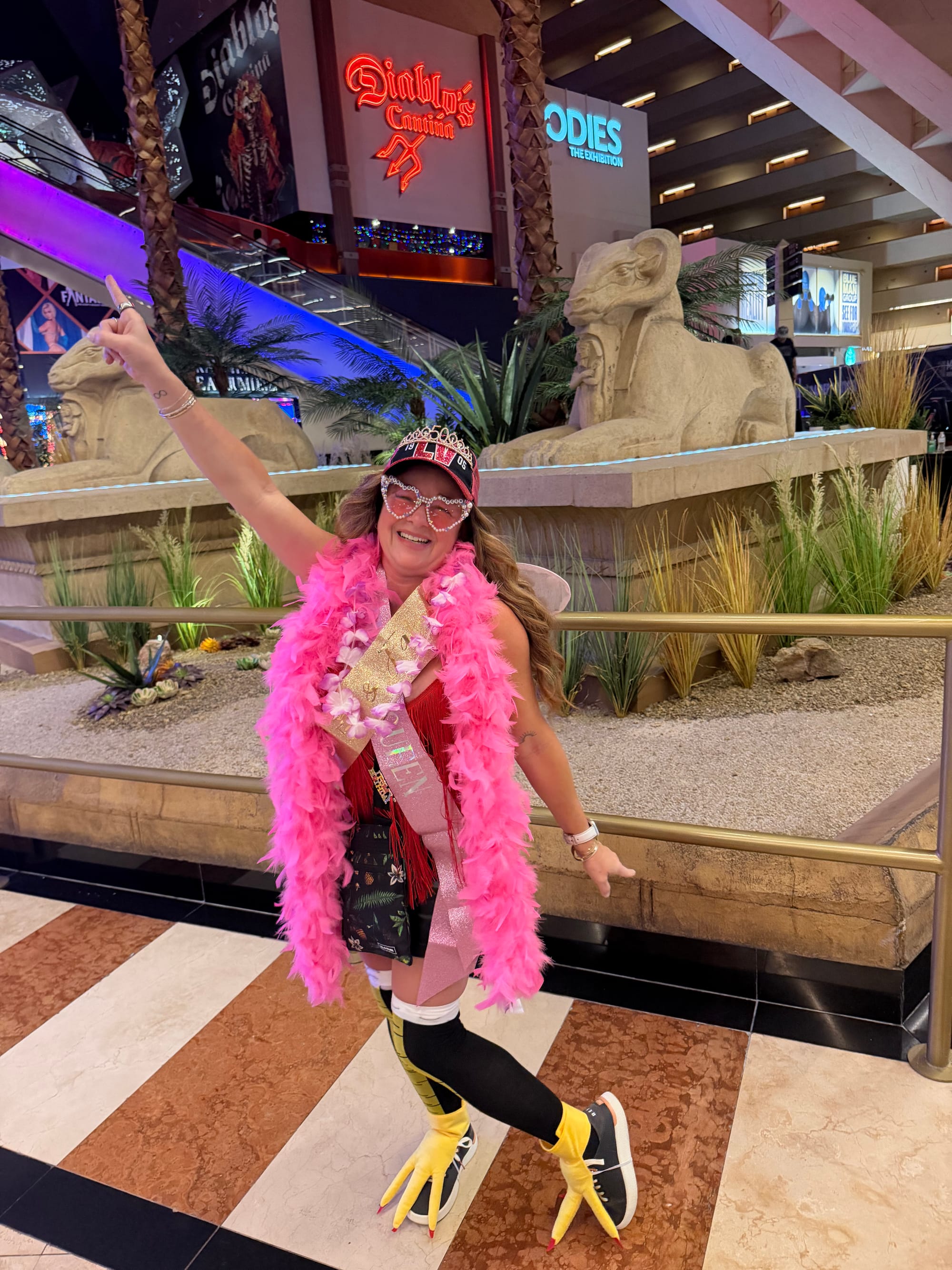 Kellie in tiara, QUEEN sash, and pink boa
